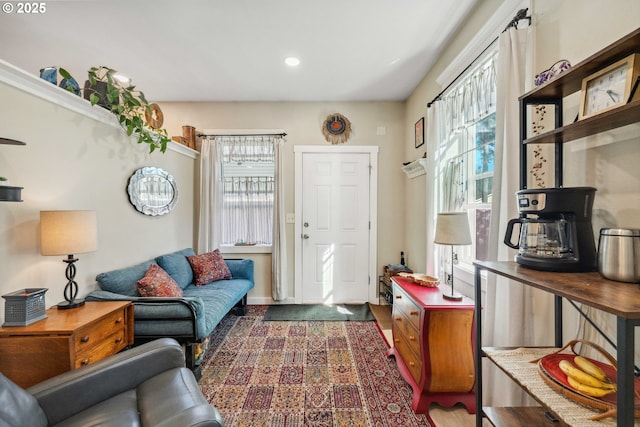living room with baseboards, recessed lighting, and plenty of natural light