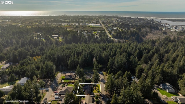 birds eye view of property with a residential view and a view of trees
