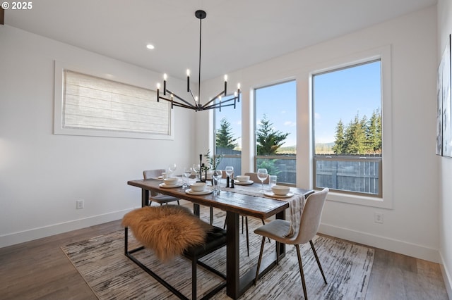 dining room featuring recessed lighting, wood finished floors, and baseboards