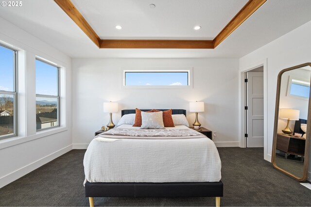 bedroom featuring dark colored carpet, a tray ceiling, recessed lighting, and baseboards