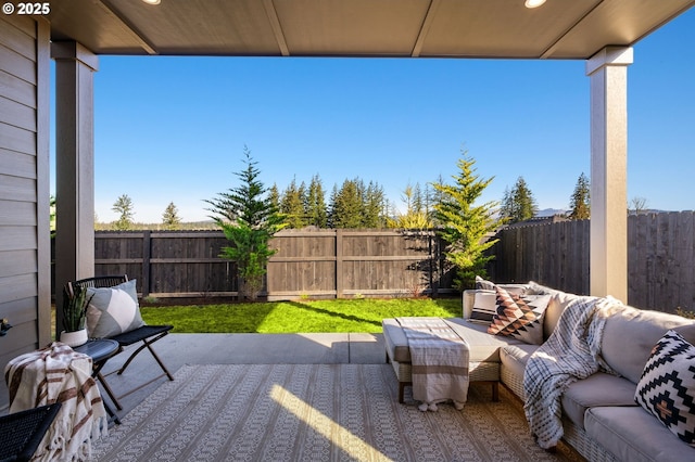 view of patio featuring a fenced backyard and outdoor lounge area