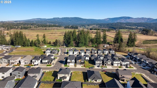 drone / aerial view with a residential view and a mountain view