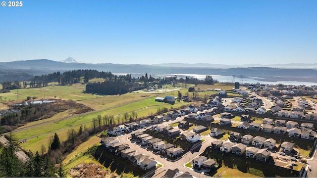 drone / aerial view with a residential view and a mountain view