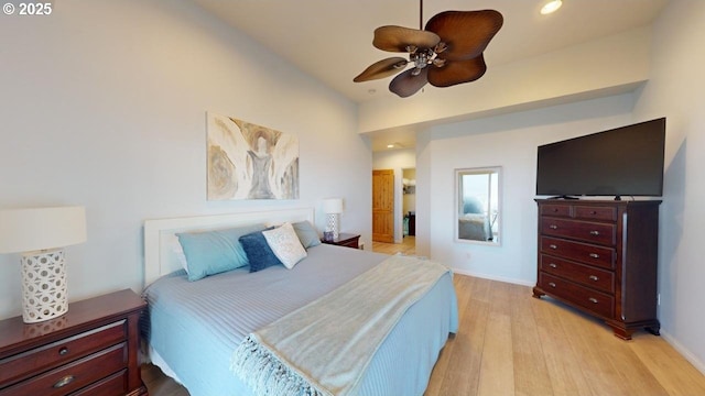 bedroom with ceiling fan and light hardwood / wood-style floors