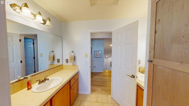 bathroom with tile patterned flooring and vanity