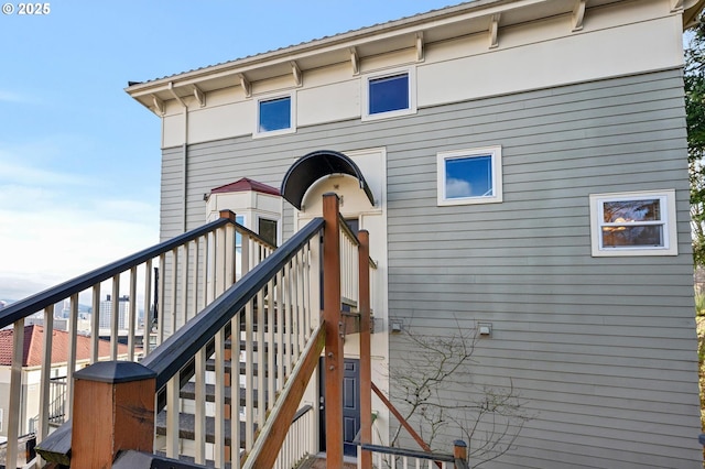 doorway to property featuring metal roof