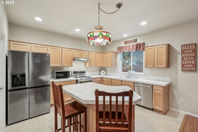 kitchen featuring light brown cabinetry, sink, and appliances with stainless steel finishes