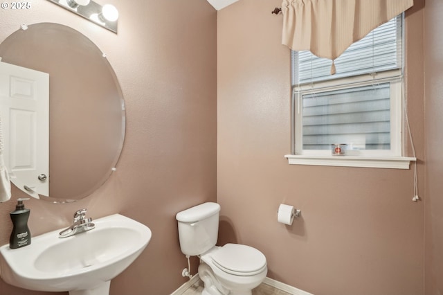 bathroom with toilet and sink