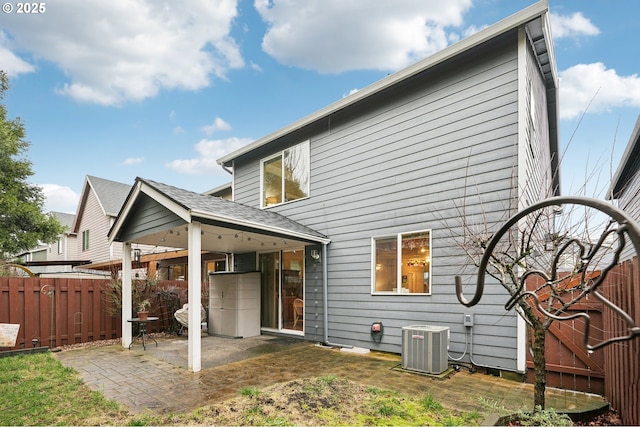 back of house featuring a patio and central air condition unit