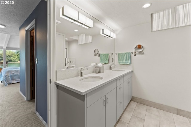 21047 NE Interlachen Ln, Fairview, OR 97024 - ensuite bathroom featuring double vanity, a textured ceiling, recessed lighting, and tile patterned flooring