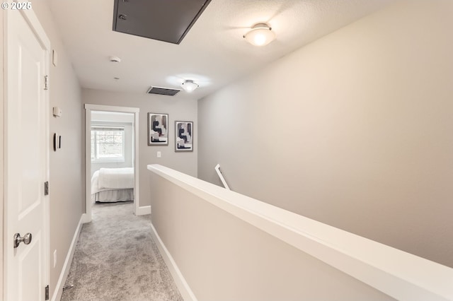 18445 SW Stepping Stone Dr Unit 16, Beaverton, OR 97003 - hall with light carpet, an upstairs landing, and baseboards