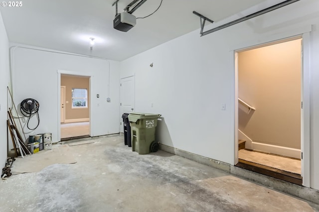 18445 SW Stepping Stone Dr Unit 16, Beaverton, OR 97003 - garage featuring a garage door opener and baseboards