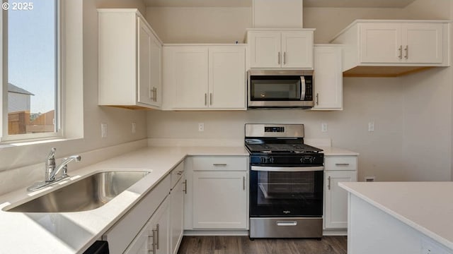 2873 V St, Springfield, OR 97477 - kitchen featuring stainless steel appliances, white cabinetry, and light countertops