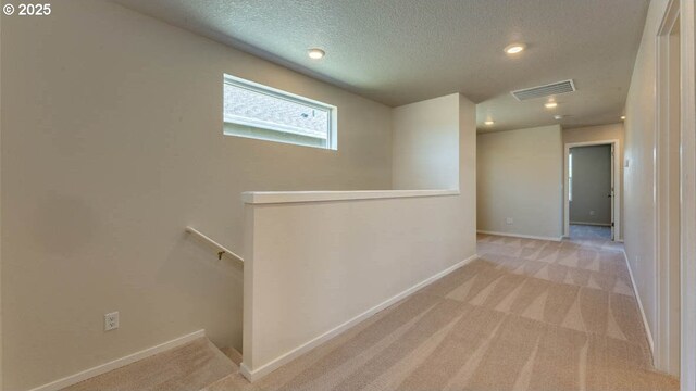 2873 V St, Springfield, OR 97477 - corridor featuring an upstairs landing, carpet floors, a textured ceiling, and recessed lighting