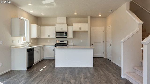 2873 V St, Springfield, OR 97477 - kitchen featuring stainless steel appliances, dark wood-type flooring, white cabinetry, a kitchen island, and recessed lighting