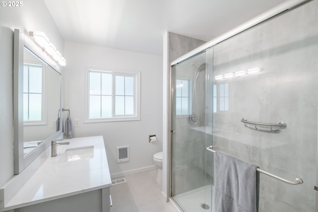 742 Shangri La Ave, Salem, OR 97303 - bathroom with vanity, toilet, heating unit, tile patterned floors, and a stall shower