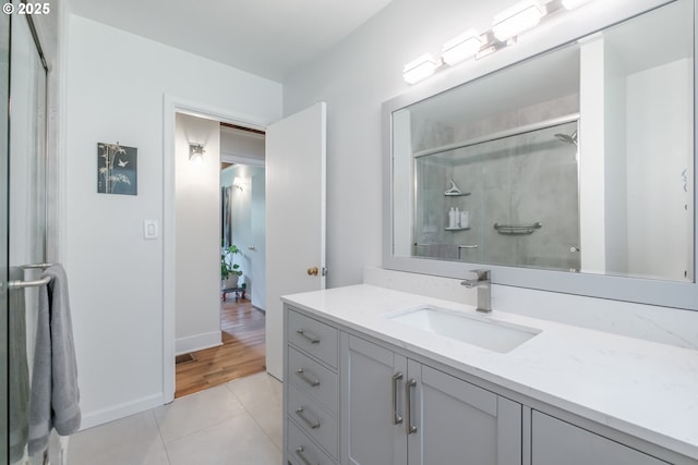 742 Shangri La Ave, Salem, OR 97303 - full bathroom with tile patterned flooring, vanity, a shower with door, and baseboards