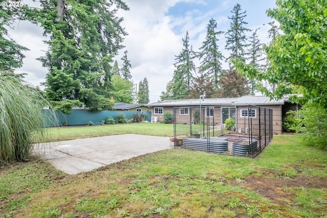 742 Shangri La Ave, Salem, OR 97303 - back of property featuring a patio, a vegetable garden, and metal roof