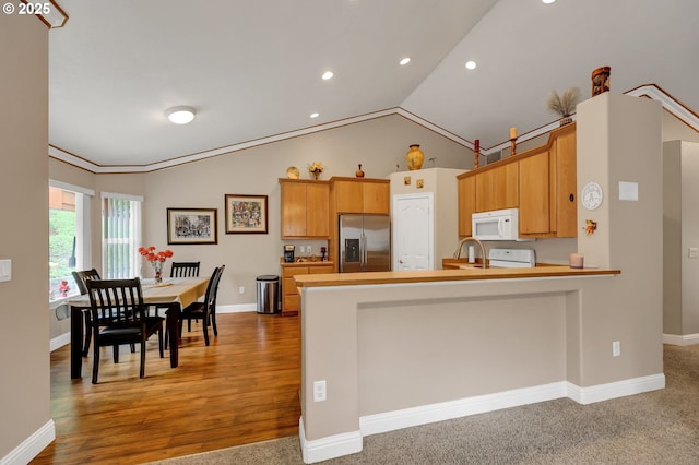 1565 Fairview Pl, Cottage Grove, OR 97424 - kitchen featuring stainless steel refrigerator with ice dispenser, white microwave, a peninsula, recessed lighting, and baseboards