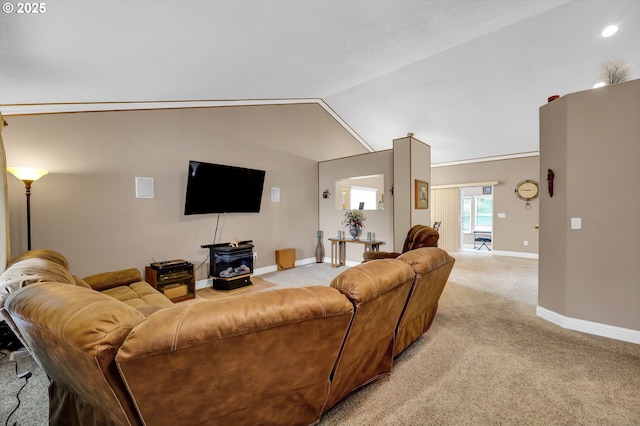 1565 Fairview Pl, Cottage Grove, OR 97424 - living area featuring baseboards, light carpet, a wood stove, and lofted ceiling