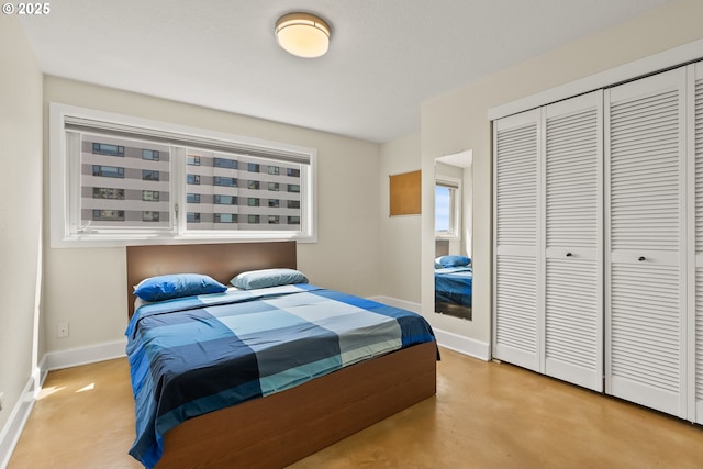 2211 SW Park Pl, Portland, OR 97205 - bedroom with a closet and finished concrete floors