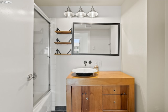 2211 SW Park Pl, Portland, OR 97205 - bathroom featuring vanity and bath / shower combo with glass door