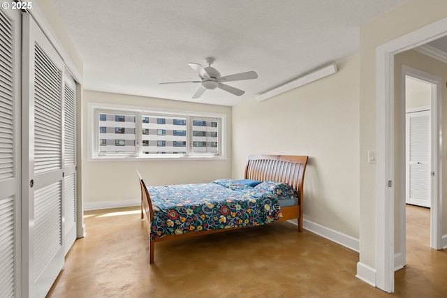 2211 SW Park Pl, Portland, OR 97205 - bedroom with a closet, finished concrete floors, and a ceiling fan