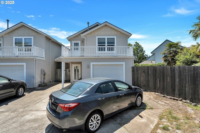 1455 NE Jessica Loop, Hillsboro, OR 97124 - view of front of home with an attached garage, driveway, and a balcony