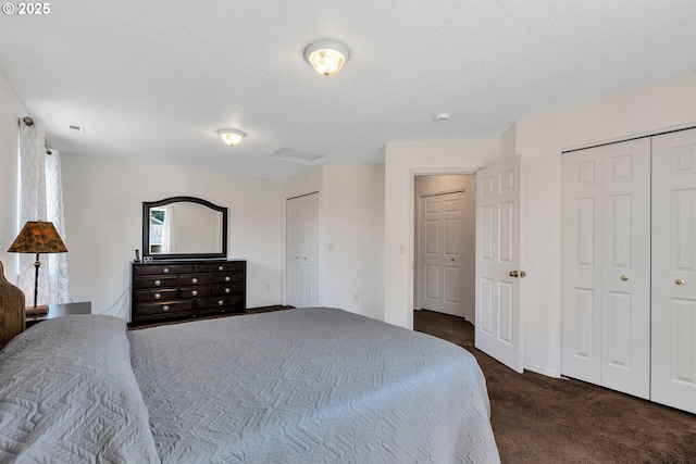 1455 NE Jessica Loop, Hillsboro, OR 97124 - carpeted bedroom with multiple closets, a textured ceiling, and baseboards