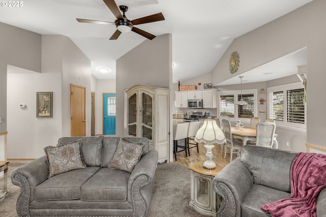 living room featuring lofted ceiling and ceiling fan