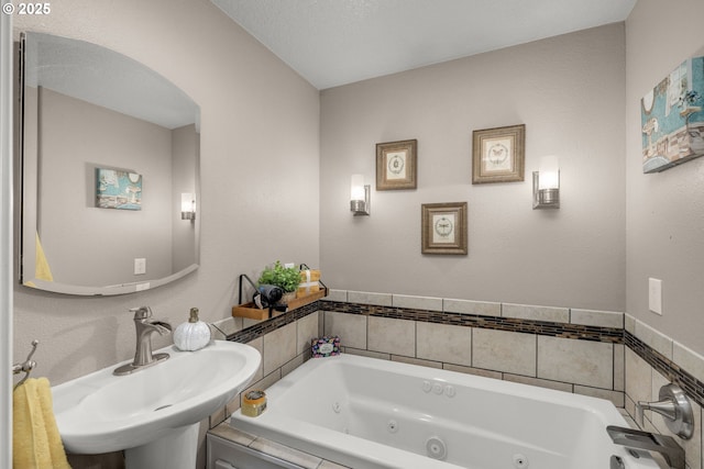 bathroom with a washtub and sink