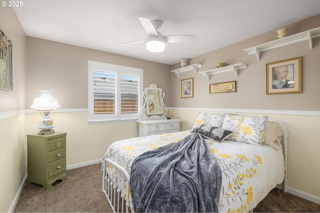 bedroom featuring ceiling fan, carpet, and a textured ceiling