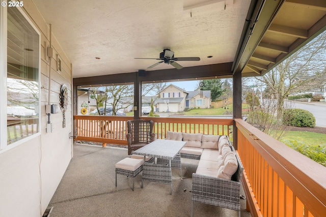 exterior space with an outdoor living space and ceiling fan