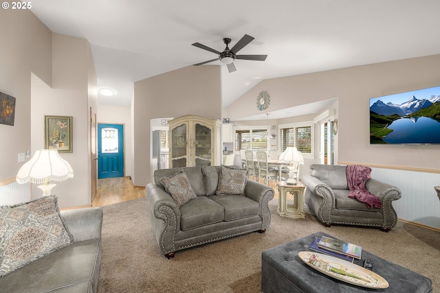 living room with ceiling fan and lofted ceiling