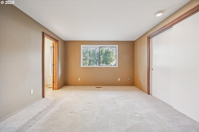 unfurnished room featuring carpet