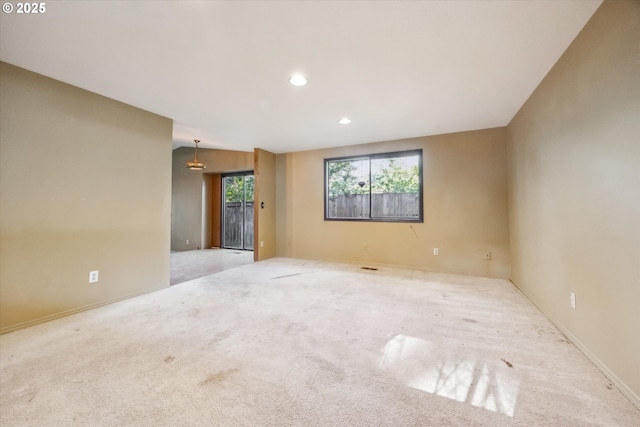 carpeted spare room with recessed lighting and baseboards