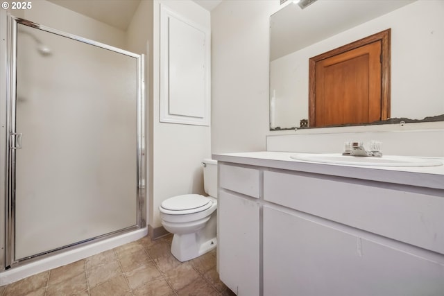 bathroom with vanity, toilet, and a shower stall