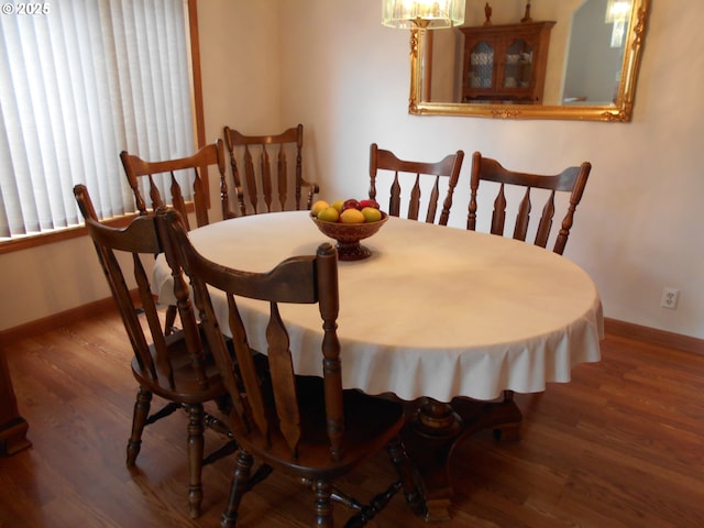4471 Spring Meadow Ave, Eugene, OR 97404 - dining room with baseboards, wood finished floors, and a chandelier