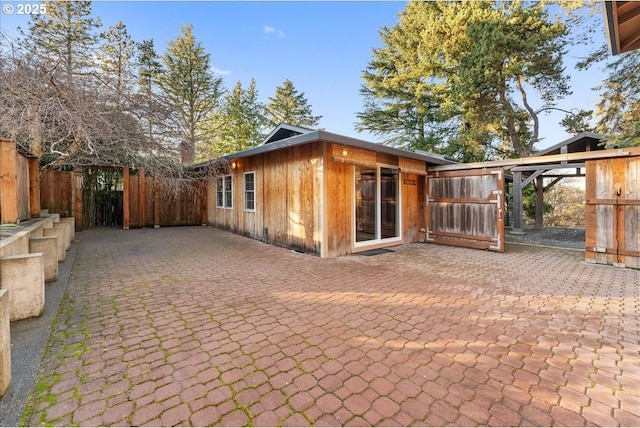 view of property exterior with a patio