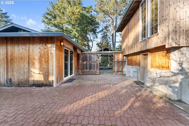 view of side of property featuring a patio