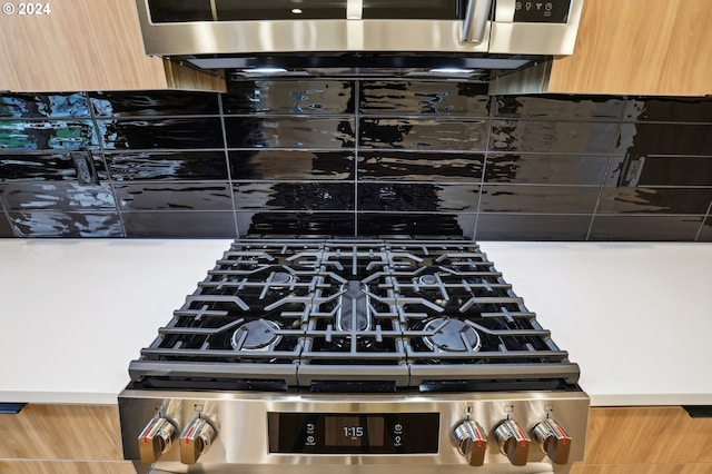 interior details featuring modern cabinets and stainless steel stove