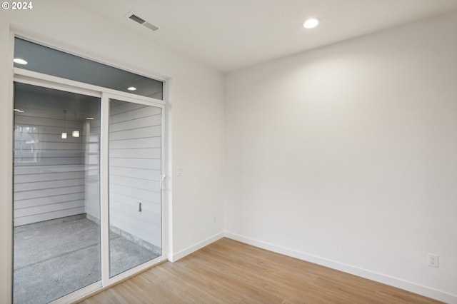 interior space with recessed lighting, visible vents, baseboards, and wood finished floors