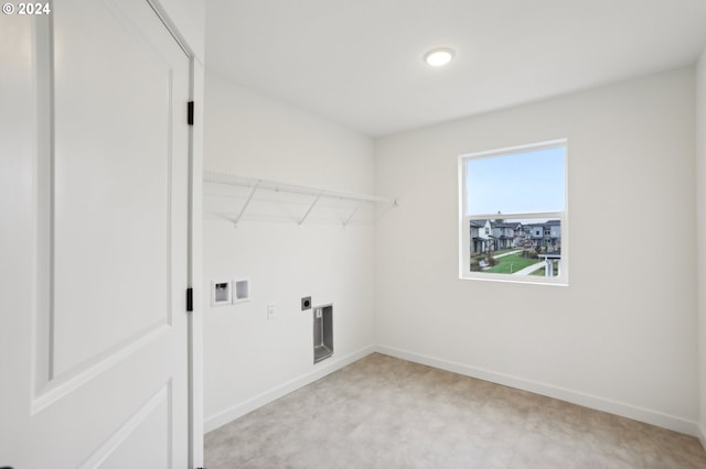 laundry room with light carpet, laundry area, baseboards, washer hookup, and electric dryer hookup