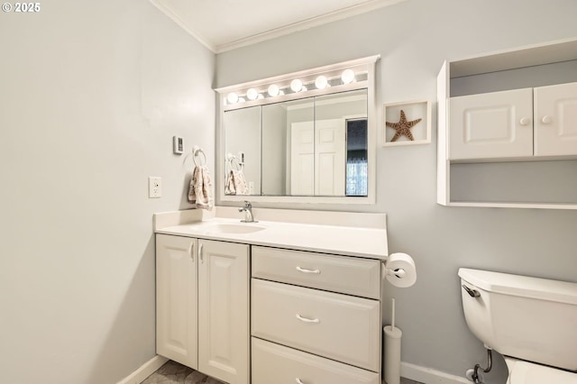 2433 NE Saratoga St, Portland, OR 97211 - bathroom with vanity, toilet, marble finish floor, baseboards, and ornamental molding