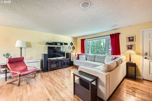 2433 NE Saratoga St, Portland, OR 97211 - living area featuring a textured ceiling and wood finished floors
