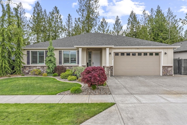 136 Zephyr Dr, Silver Lake, WA 98645 - single story home featuring stone siding, a garage, concrete driveway, and roof with shingles