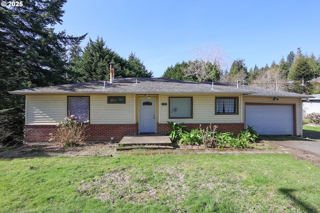 ranch-style home featuring brick siding, an attached garage, and a front lawn