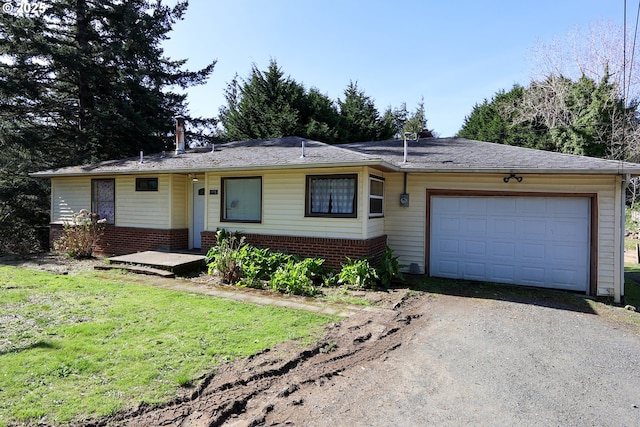 single story home with brick siding, a front yard, a garage, and dirt driveway