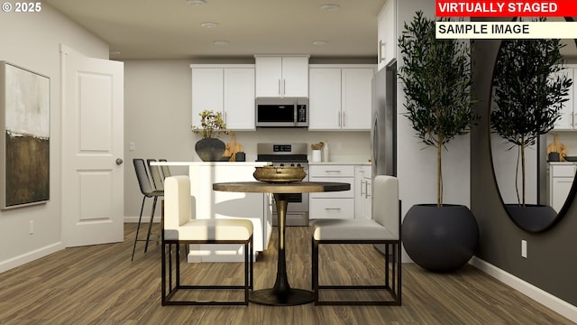 856 Eaden St, Woodburn, OR 97071 - kitchen featuring stainless steel appliances, dark wood-style flooring, white cabinetry, and light countertops