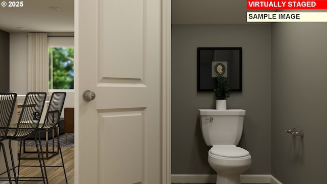 856 Eaden St, Woodburn, OR 97071 - bathroom featuring toilet and wood finished floors